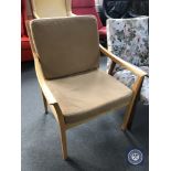 A late 20th century beech framed armchair