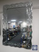 An all glass Venetian style mirror