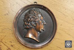 A circular bronze relief plaque of Johann Wolfgang von Goethe,