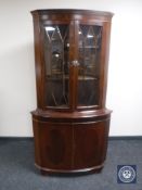 A reproduction double door corner display cabinet