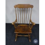 A spindle back rocking chair