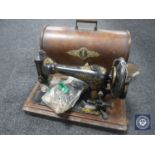 A Singer sewing machine with accessories in case
