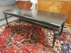A 19th century style rectangular library table on reeded legs,