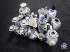 An antique tin glazed blue and white vase together with a collection further contemporary blue and