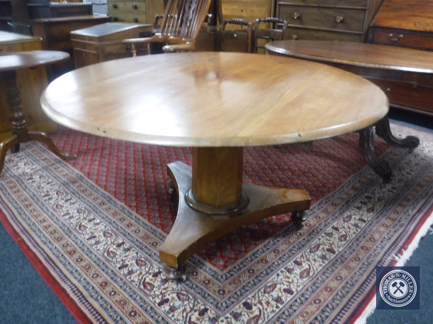 A circular Victorian mahogany tilt top breakfast table