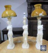 A set of three Grecian style table lamps,