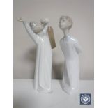 Two Lladro figures, Boy Awakening and Boy Whistling,