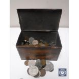 A tin containing a quantity of coins, commemorative crowns etc.