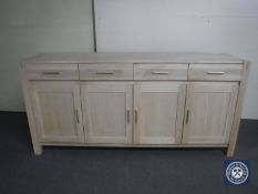 A contemporary four door sideboard fitted four drawers