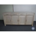 A contemporary four door sideboard fitted four drawers