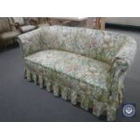 An early 20th century settee in floral fabric