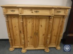 An antique style pine breakfront side cabinet,