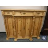 An antique style pine breakfront side cabinet,