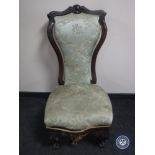 A Victorian mahogany shaped back bedroom chair