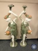 An impressive pair of carved marble figural floor lamps of maidens holding flowers,