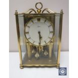 A brass and glass panelled Koma mantel clock