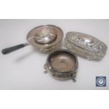 A silver salt together with a silver strainer on stand and a silver mounted dressing table pot