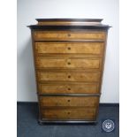 A late 19th century inlaid walnut chest on chest