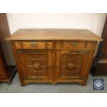 An Edwardian oak sideboard fitted two drawers,