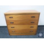 A mid 20th century teak four drawer chest