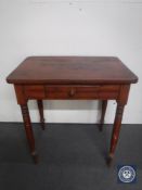 An early 20th century kitchen table fitted a drawer