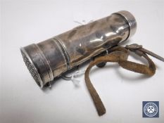 A novelty silver torch with leather carry handle