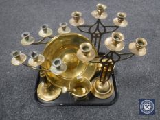 A tray of brass candlesticks, two chargers,