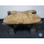 A leather seated camel stool