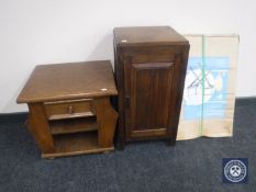 An oak pot cupboard together with an oak magazine table fitted with a drawer and a boxed director's