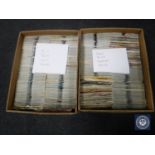 Two boxes containing singles to include Oasis, Elvis, The Beatles,