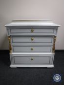 An antique hand painted pine four drawer chest