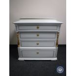 An antique hand painted pine four drawer chest