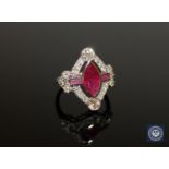 An 18ct white gold ruby and diamond ring, a central marquise-cut deep red ruby weighing 1.