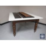 A Victorian mahogany wind out table with three leaves (top painted) CONDITION REPORT: