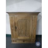 An antique oak cabinet fitted a drawer beneath