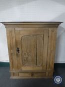 An antique oak cabinet fitted a drawer beneath
