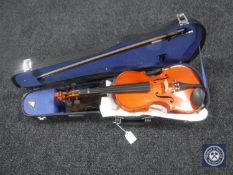 A Chinese child's violin with bow in case