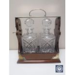 Two bottle cut crystal and mahogany silver plated Tantalus with key CONDITION REPORT: