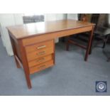 A mid 20th century teak desk fitted four drawers