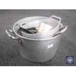 Two large aluminium cooking pans together with further cooking items