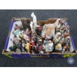 A box containing Japanese and continental figures,