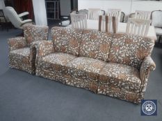 A mid 20th century three seater settee and armchair in floral fabric