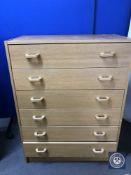 A mid 20th century oak six drawer chest