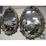 A pair of ornate contemporary mirrors
