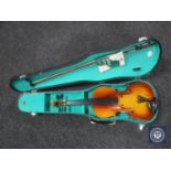 A contemporary violin and bow in case