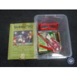 A Subbuteo table soccer game in box together with a crate containing related items,