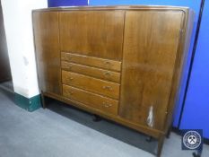 A mid 20th century walnut cocktail sideboard