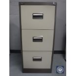 A three drawer metal filing cabinet