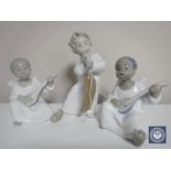 Three Lladro cherub musicians,