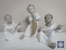 Three Lladro cherub musicians,